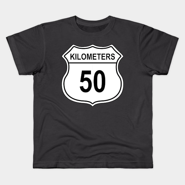 50 Kilometer US Highway Sign Kids T-Shirt by IORS